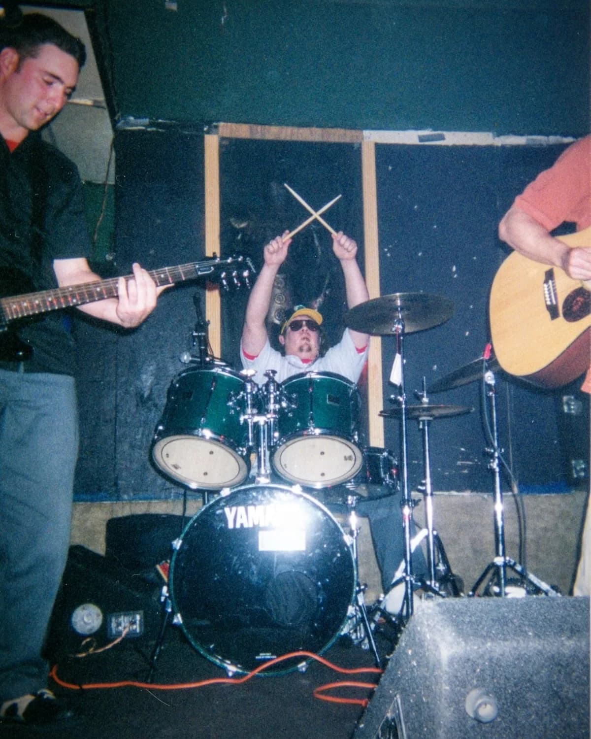 Fading Maize performing with drums and acoustic guitars